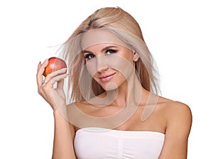 Blond woman eat red apple