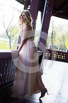 Blond woman in evening gown posing
