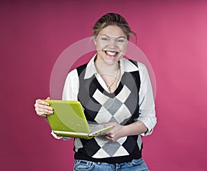 Blond woman with green laptop