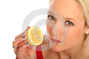 Blond woman with a half citron