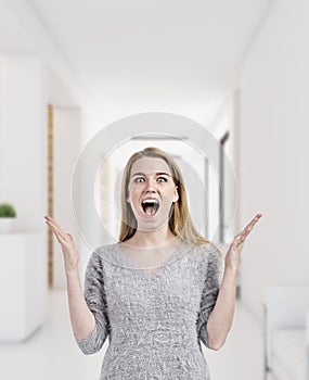 Blond woman is happy to work in office