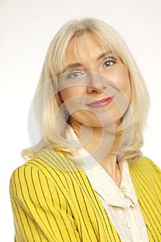 blond woman in her 50s posing