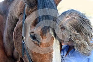 Blond woman and  her  horse