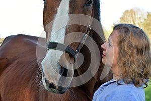 Blond woman and  her  horse