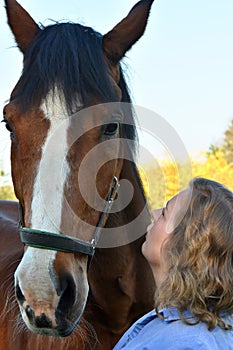 Blond woman and  her  horse