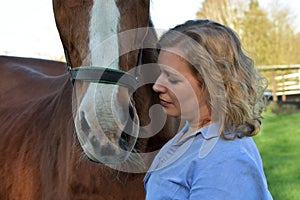 Blond woman and  her  horse