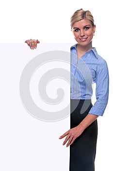 Blond woman holding a blank message board.