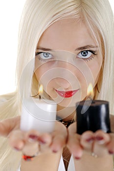 Blond woman holds candls
