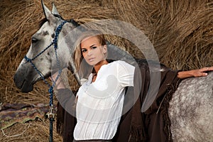 Blond woman with horse