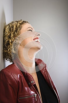 Blond woman laughing.