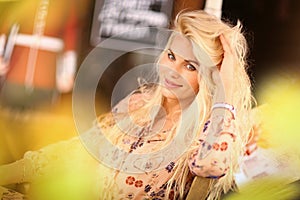 Blond woman on lunch break sit in summer outdoor cafe with cup o