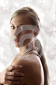 Blond woman with pearl