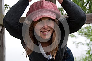 Blond Woman in Pink Hat Hanging Out
