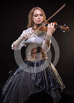 Blond woman playing the fiddle