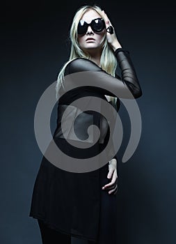 Blond woman posing in black lingerie