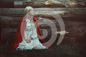 Blond woman with red hooded cloak photo