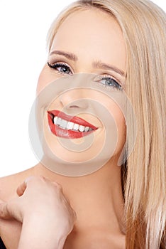 Blond woman with red lipstick smiling