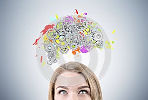 Blond woman s head and brain with gears