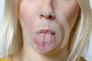 Blond Woman Sticking her Tongue Out