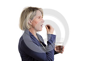 Blond woman with tablet and waterglass