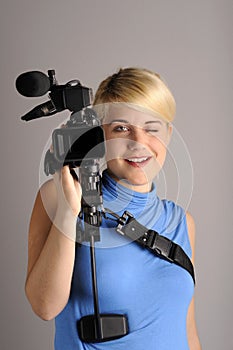 Blond woman with video camera