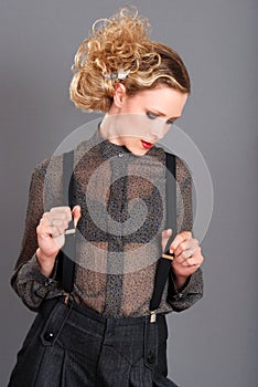 Blond woman wearing black suspenders