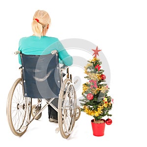 Blond woman in wheel chair while Christmas