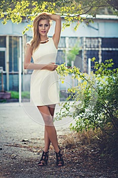 Blond woman in white dress