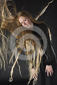 Blond Woman with Wind Blowing Through Long Hair