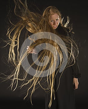 Blond Woman with Wind Blowing Through Long Hair
