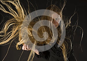 Blond Woman with Wind Blowing Through Long Hair