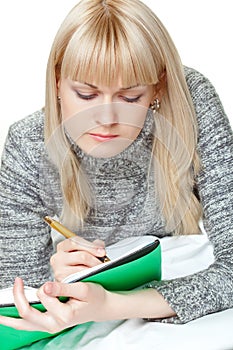 Blond woman writing