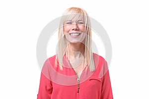Blond young woman with a beaming smile