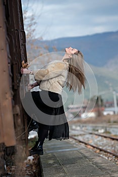 Blond young woman climbed on a wagon train