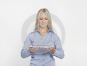 Blond young woman with IBook