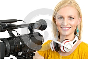 Blond young woman with professional video camcorder, on white