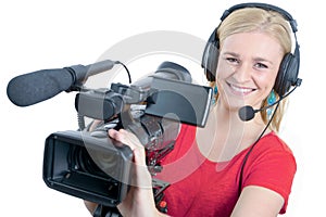 Blond young woman with professional video camcorder, on white