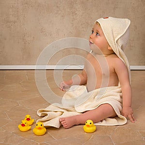 Blonde baby in bath towel