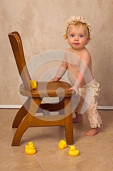 Blonde baby first steps without chair