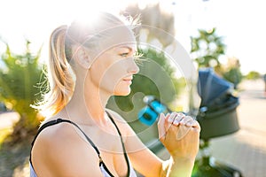 blonde beautiful woman ready to be the best mother and getting in shape after giving birth in tropics background beach