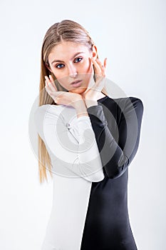 Blonde blue eyed lady wearing a black and white dress