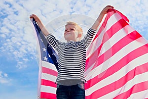 Blonde boy waving national USA flag outdoors over blue sky at summer - american flag, country, patriotism, independence