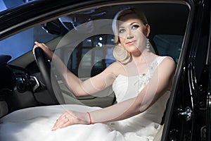 Blonde bride in a car