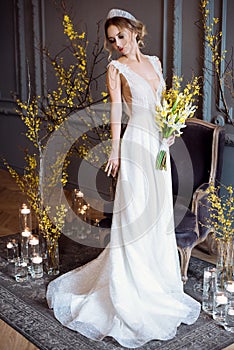 Blonde bride in fashion white wedding dress with makeup