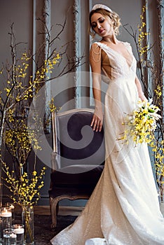 Blonde bride in fashion white wedding dress with makeup