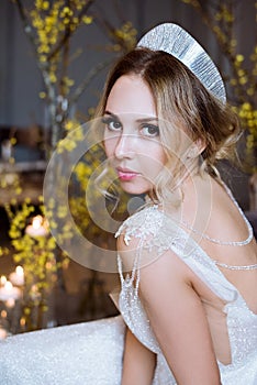 Blonde bride in fashion white wedding dress with makeup