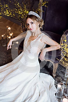 Blonde bride in fashion white wedding dress with makeup