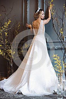 Blonde bride in fashion white wedding dress with makeup