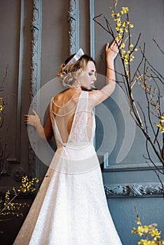 Blonde bride in fashion white wedding dress with makeup