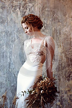 Blonde bride in fashion white wedding dress with makeup